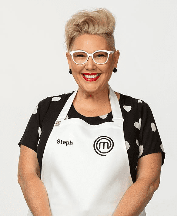Smiling woman wearing MasterChef apron.