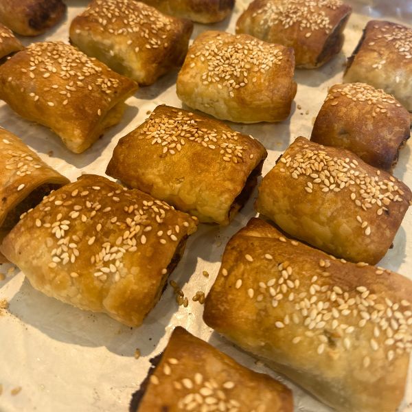 home made sausage rolls sausage rolls on tray