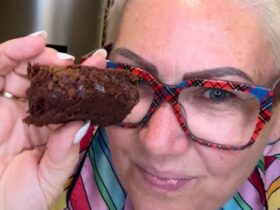 Brownie cooked and holding a piece