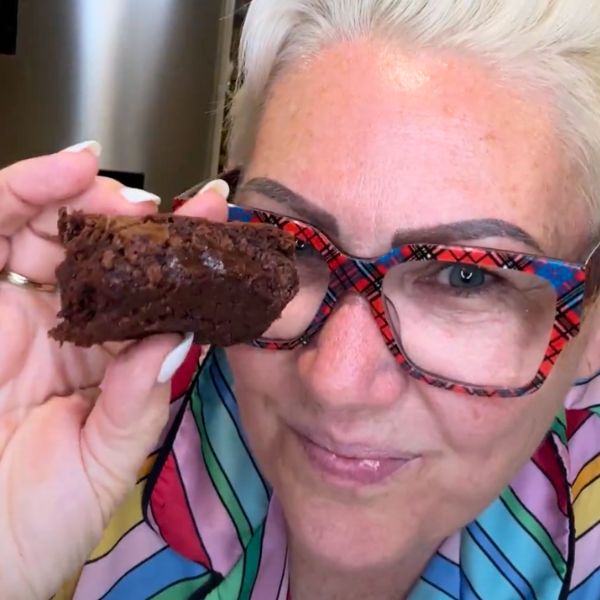 Brownie cooked and holding a piece