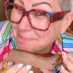 Chocolate Custard Pie holding a slice