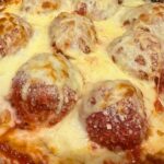 Chicken parma meatballs cooked in dish