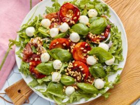 Peach Bocconcini Salad with Honey, Basil and Proscuitto on plate