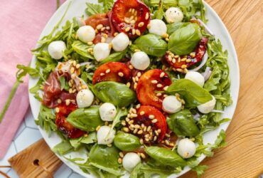 Peach Bocconcini Salad with Honey, Basil and Proscuitto on plate