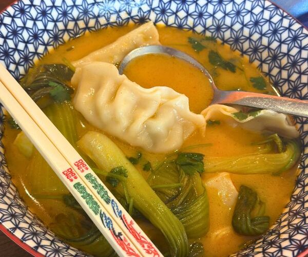 red curry dumpling soup in bowl