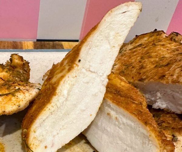 Air Fryer Chicken Breast sliced on board