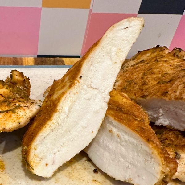 Air Fryer Chicken Breast sliced on board
