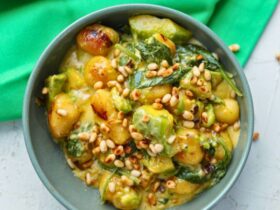 Avocado Gnocchi with Spinach and Pinenuts in bowl and served