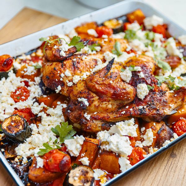 One Pan Greek Chicken Bake in pan One Pan Greek Chicken Bake in pan and cooked