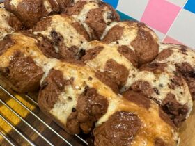 Choc Chip Hot Cross Buns on cooling tray