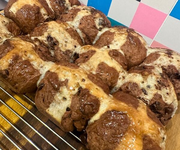 Choc Chip Hot Cross Buns on cooling tray