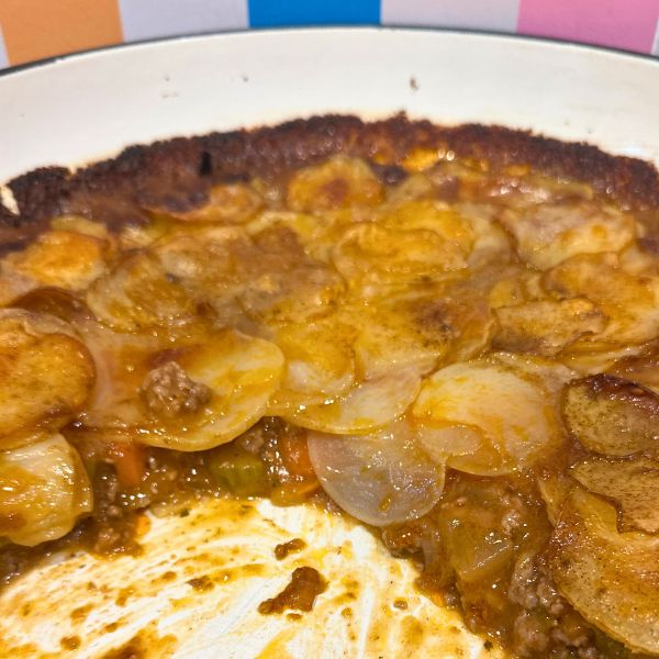 Lamb and Potato Pie sliced Lamb and Potato Pie cut and sliced in dish