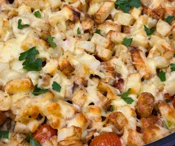 Pesto Chicken Bacon Loaded Potatoes cooked in dish