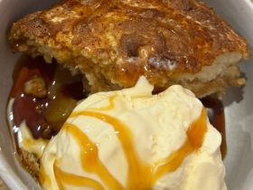 Apple Pudding served in bowl with icecream