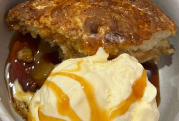 Apple Pudding served in bowl with icecream