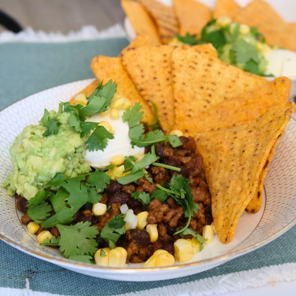 Chilli Con Carne in bowl with corn chips